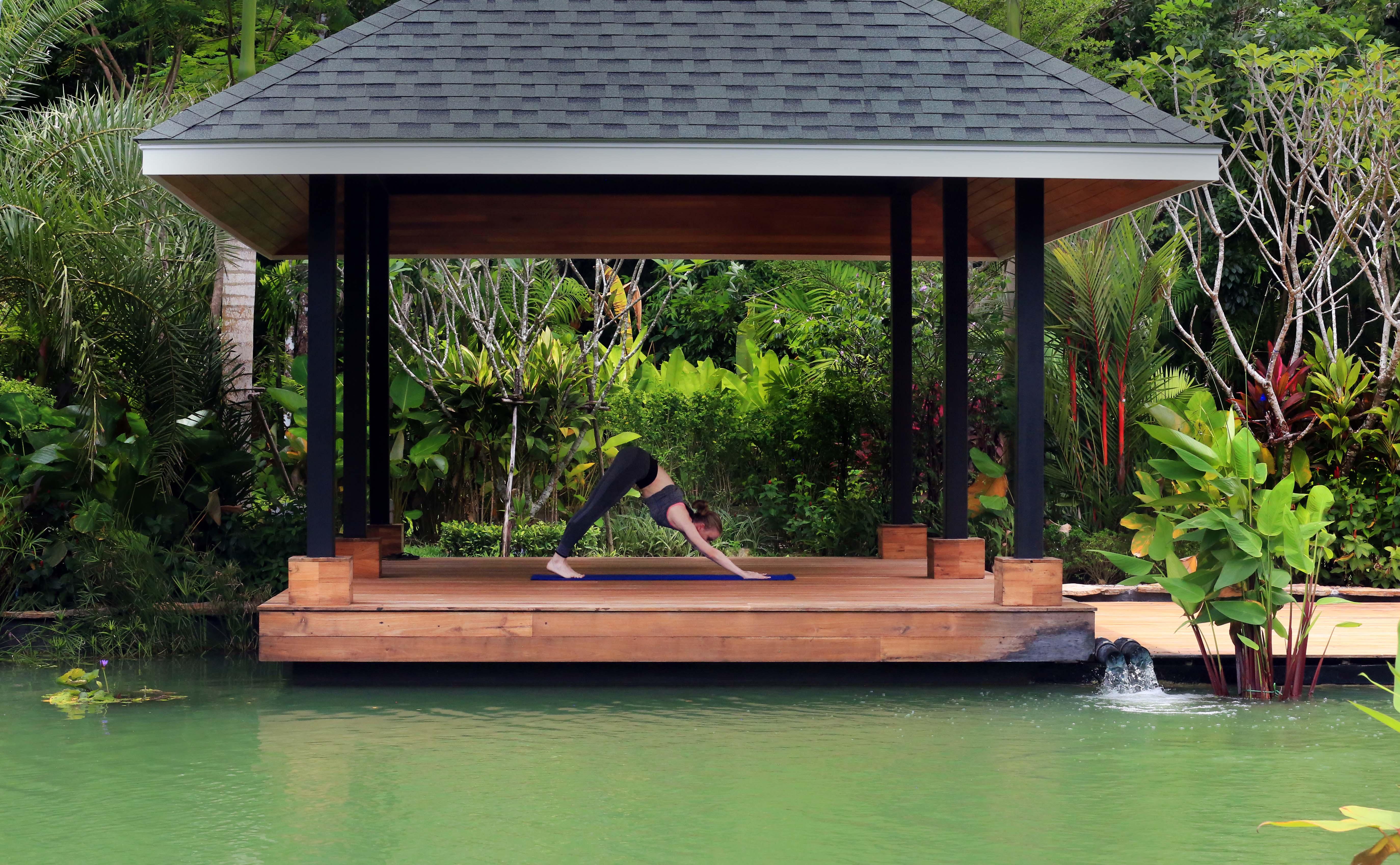 The Pavilions Phuket (Adults Only) Банг Тао Бийч Екстериор снимка A woman practicing yoga at the BANYAN TREE Spa
